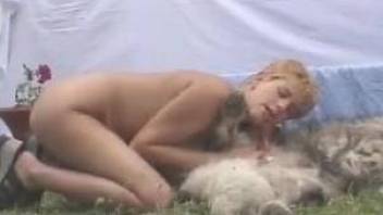 Short-haired MILF fucks a horny dog outdoors