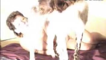 Wavy-haired vixen deepthroating a canine's stiff dick