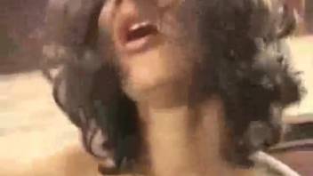 Hispanic woman riding up and down on a hard canine cock