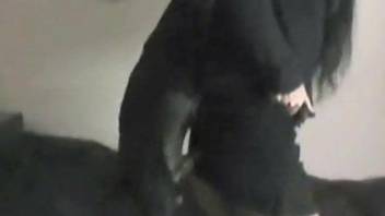 Brunette in black getting dominated by a doggo
