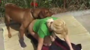 Energized blonde bends ass to fuck with the dog