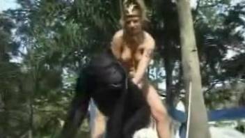 Hot blonde dressed like African princess sucks chimpanzee's cock